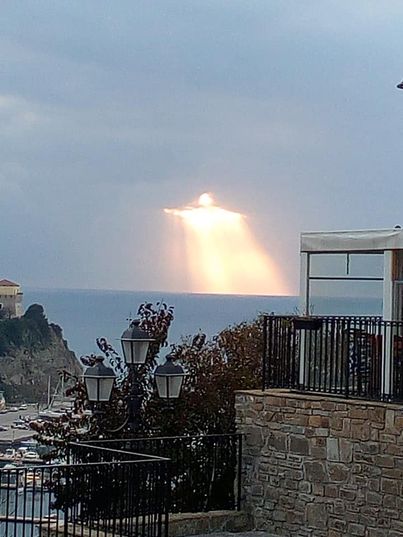 Man captures glowing figure shining through clouds