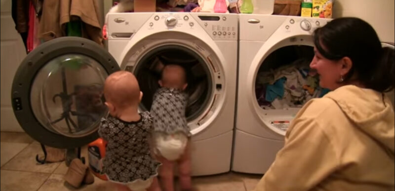 Little twin babies are the best helpers of their mother…