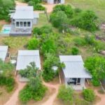 Best friends of 20 years buy plot of land and build tiny town so they can vacation and retire together