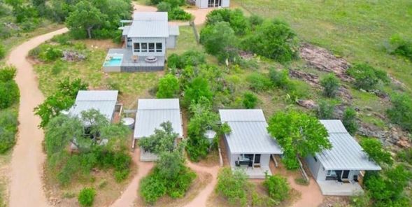 Best friends of 20 years buy plot of land and build tiny town so they can vacation and retire together