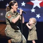 This couple performs the most famous 90s hit. The audience stands and applauds.